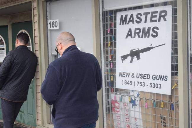 Customers waiting to buy a gun this spring at Master Arms in Sloatsburg, N.Y. Gun ownership still skews heavily white, male, and conservative, but gun store owners are seeing new faces as well. (Photo by Rose Miller)
