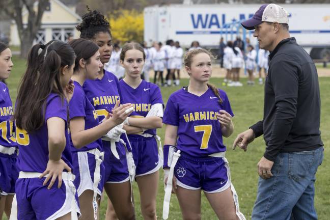 Girls on the field, ice, mat Warwick Valley coach Rocco Manno talks to his girls’ flag football team during a 2024 game against Middletown. (Photo provided by the Warwick Valley School District)