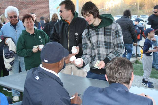 Yankee Willie Randolph kicks off the Little League season Willie Randolph signed baseballs for fans. Here, Patrick McMurdy, a student at the Okinawan Karate School in Kinnelon, gets several baseballs signed. In line behind him are Chris Miller, owner of the school, and Christine Touw, an assitant instructor. Okinawan Karate School was one of the sponsors for the night.