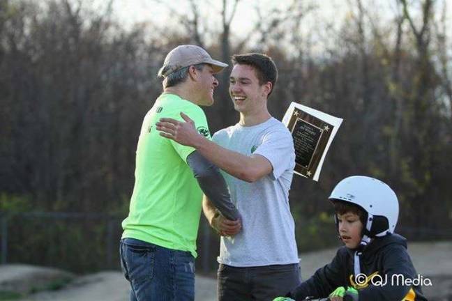 West Milford’s Family Pump Track: a place to find fun and a role model Photos by Quinton Johnson Jay Huggins received a plaque for all of the work he's done making the pump track here in West Milford the place that it is. Casey Tynan presented it to him. Huggins is admired by Tynan and many others who volunteer at the pump track, and give him credit for making it the close-knit fun place it is.