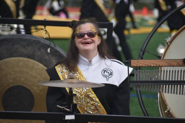 A member of the West Milford Highlander Marching Band is all smiles during the performance by the two-time national champion.