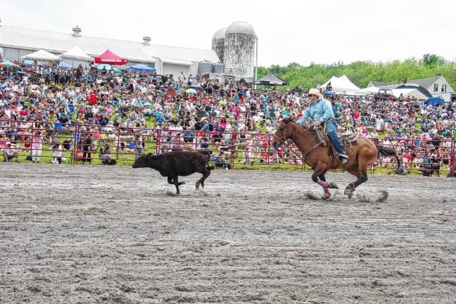 Rodeo is Saturday at Green Valley Farms Rodeo competitor Tyler Zebrovious of Fredonia, Pa., aims his lasso during the tie-down contest.