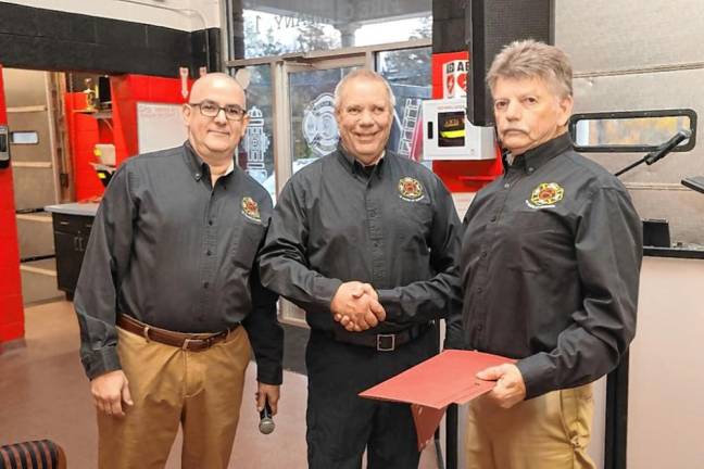 Fire Company 6 honors Aldrich From left are Fire Company 6 president Chris DeWilde, Chief Wayne Morrissey and Ed Aldrich Jr. (Photo provided)