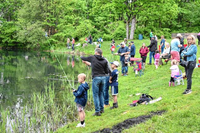 ‘Fishing and family fun’ Nearly 100 children and adults try their luck at the annual Kids Fishing Derby on Saturday, May 17. (Photos by Rich Adamonis)