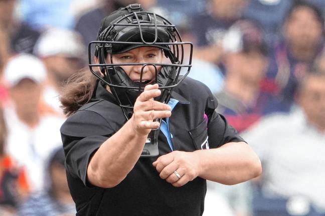 Pawol to be MLB’s first female umpire Home plate umpire Jen Pawol calls a strike during the third inning of a spring training baseball game between the Miami Marlins and Houston Astros on March 10, 2024, in West Palm Beach, Fla. (AP File Photo/Jeff Roberson)