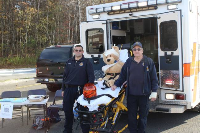 'Spooktacular' fundraiser a gargantuan success First responders and their "patient" wait to hand out treats. photo provided