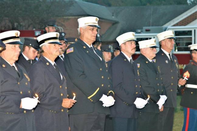 Firemen stand at attention during the 9/11 Ceremony at town hall in September.