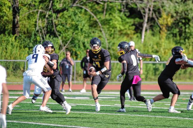 West Milford defeats Paramus, 44-13 WF3 West Milford quarterback Aydin Deane is on the move with the ball. He scored one passing touchdown and one rushing touchdown. (Photo by George Leroy Hunter)