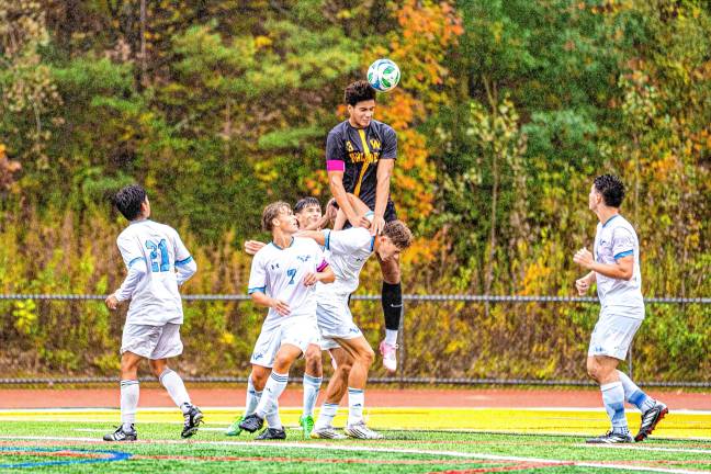 Highlanders win 7 in a row HI1 Julian Pierre goes to hit the ball in the Passaic County Tournament quarterfinal game against Wayne Valley on Saturday, Oct. 11. The Highlanders lost, 2-0. (Photos by TJ Nolan)