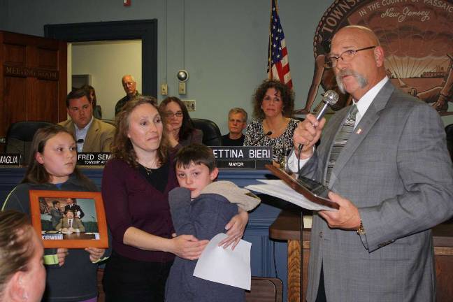 Township honors Kirwans as volunteers of the year Photo by Linda Smith Hancharick In an emotional presentation, Councilman Joe Smolinski presented Lorraine Kirwan the Volunteer of the Year award for 2011. Kirwan and her husband, Dennis, who died in January, were the dual recipients. The Kirwans' children, Meghan, left, and Ryan were there to accept the award with their mom.