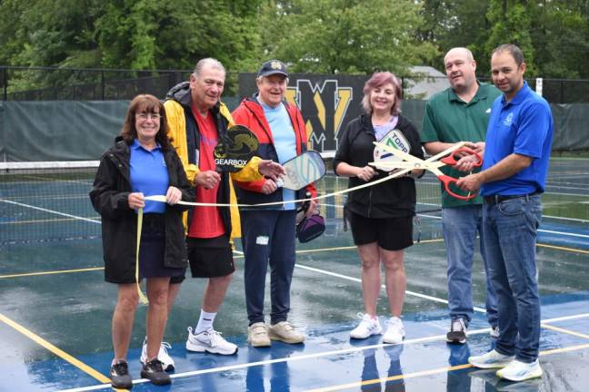 Posing at the ribbon-cutting for the new outdoor pickleball courts are, from left, Community Services &amp; Recreation program coordinator Sue Pappas, Recreation Center pickleball adviser Ed Bogin, local pickleballer Jack Waligora, pickleball ambassador Nina Sutera, Township Council President Kevin Goodsir and Community Services &amp; Recreation director Dan Kochakji. (Photos by Rich Adamonis)