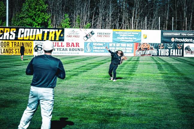 Adrian Guerra, who graduated from Newton High School in 2018, warms up with a game of catch. He formerly played for the Ecuador national team.