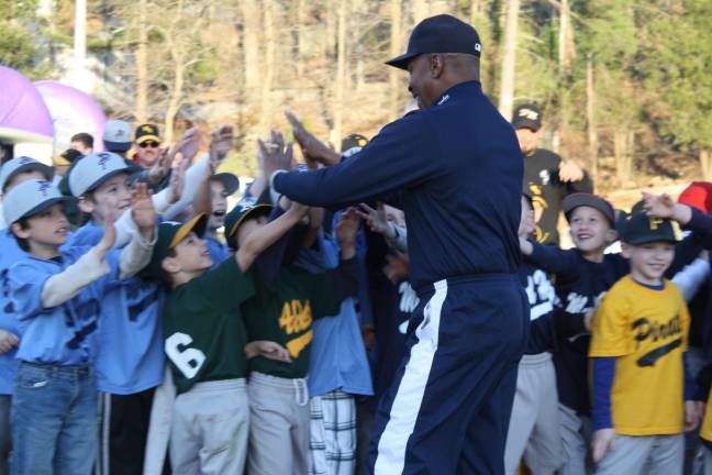 Yankee Willie Randolph kicks off the Little League season Willie Randolph brought lots of smiles to the kids as he ran around the infield dirt high fiving them.