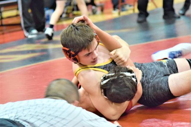 WMJW wrestler Nate Ford pins his opponent to advance to the finals.