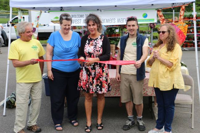 A bounty at the farmers' market The West Milford Farmers' Market is now open! The ceremonial ribbon cutting was attended by, from left, David Watson-Hallowell of Sustainable West Milford, Rev. Janet Macgregor-Williams of the West Milford Presbyterian Church, Mayor Bettina Bieri, Luke Slott of Sustainable West Milford and Triscia Hennessy, manager of the market.