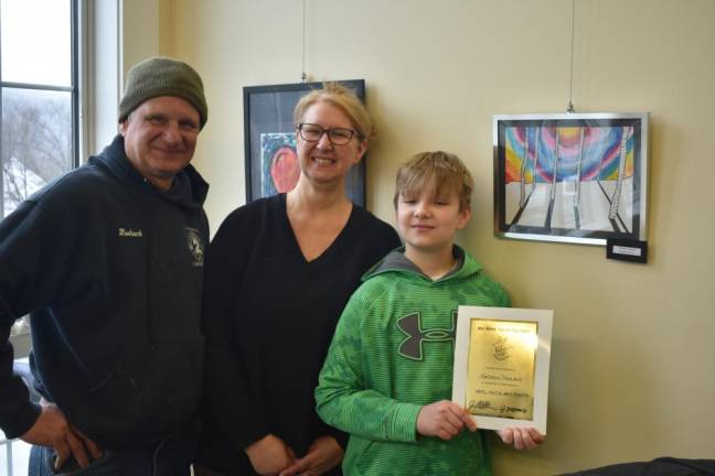 Nathan Niskayuna, 10, poses with his artwork and recognition certificate and his parents, Dan and Stacey. (Photos by Rich Adamonis)