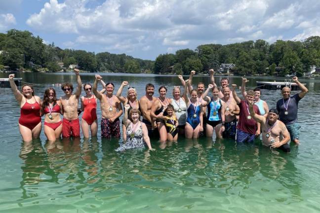 Going the distance Participants in the Lindy’s Lake Distance Swim pose for a photo after the event Sunday, Aug. 6. (Photo by John Caggiano)