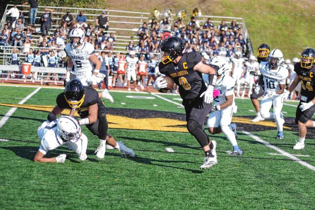 West Milford defeats Paramus, 44-13 West Milford ball carrier Chase Tyburczy ran for 119 yards and scored two touchdowns. (Photo by George Leroy Hunter)