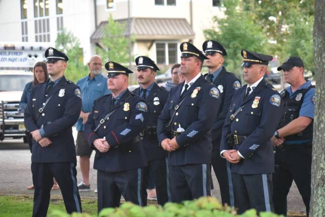 Photos of 9/11 Memorial Ceremony Police officers stand at attention during the ceremony.