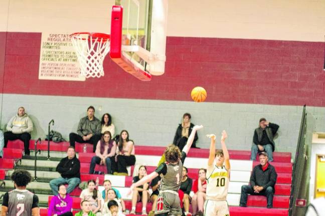 West Milford’s Ognjen Ljusic (10) launches the ball from afar. He scored 14 points.