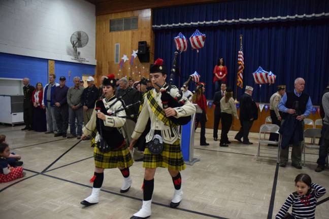 The West Milford High School Bagpipers lead veterans into the auditorium at Upper Greenwood Lake School Wednesday for a Veterans Day ceremony. photos by jen Iwaszczuk