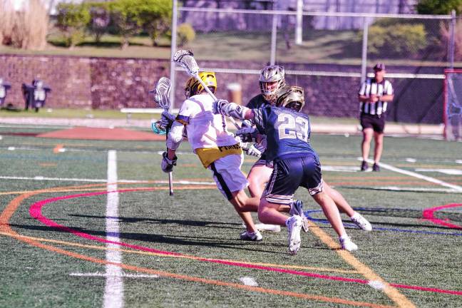 Sports roundup: Falcons advance to MCT semifinal A ball-carrying Jefferson Falcon is pursued by a pair of Pope John Lions.