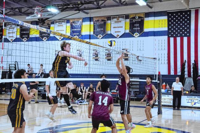 Sports roundup: Shatzel wins 3 gold medals Jefferson's Raymond Bradley swats the ball past the net. He made two kills and one block.