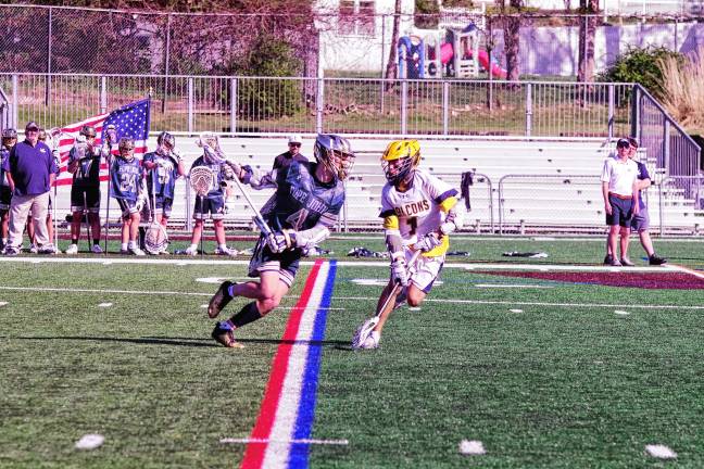 Sports roundup: Falcons advance to MCT semifinal Pope John’s Peyton Fox (4) runs with the ball as he faces Jefferson’s Calen Reid. Fox scored two goals.