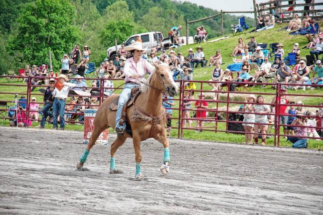 Rodeo is Saturday at Green Valley Farms Rodeo competitor Emily Kenthack of Califon rides her horse during the barrel race contest.