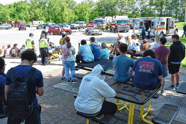 Simulated crash meant as warning Students watch the first-responders at work.