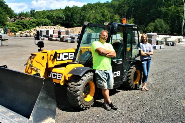 Stock Yard Supply Company Owner Jim Stock and Office Manager Lisa Abrahams stand in the yard of the Warwick Turnpike business in Hewitt.