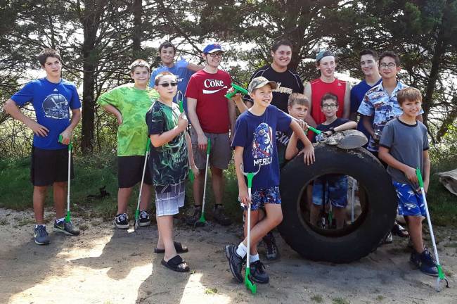 Members of West Milford&#x2019;s Boy Scout Troop 114 camped overnight at Sandy Hook on Saturday. The scouts spent part of the day performing service work by helping to clear the beach of debris. Troop 114 meets every Wednesday at St. Joseph&#x2019;s Church on Germantown Road.