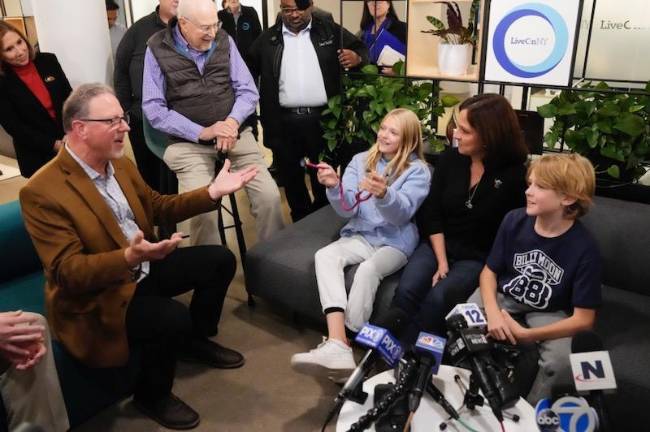 Rich Grehl, 63, of West Milford talks to the family of his heart donor: Kristina Moon and her children, Brianne, 11, and Colin, 9.