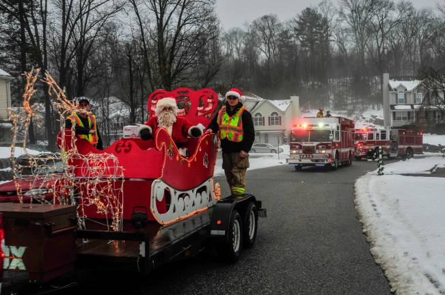 Fire Company 4 escorted Santa up Orleans Lane Sunday morning, but there was more than candy canes to give out.