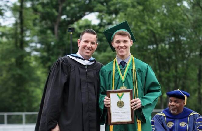 Michael Bruno, principal of St. Joseph Regional High School, poses with Timothy Doherty, who was awarded the St. Joseph Medal.