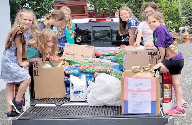 Local Girl Scouts collected products worth more than $1,000 and $600 in cash for the shelter.