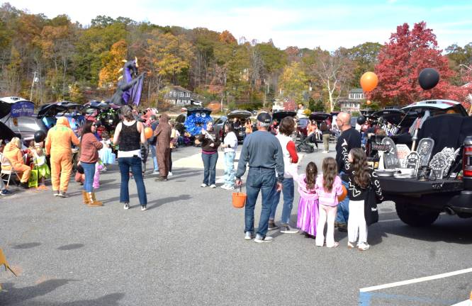 UGL Clubhouse hosts trunk or treat Happy UGL families participating in the costume.