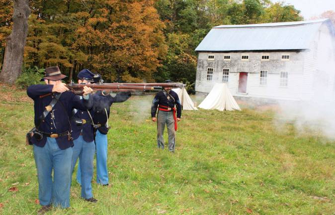 History comes alive at Long Pond Ironworks Ready, aim, fire. Civil War reenactors brought history to life at the Long Pond Ironworks last Saturday. Representing the 6th New Hampshire Volunteers, the camp site is authentic. Photos by Ginny Raue