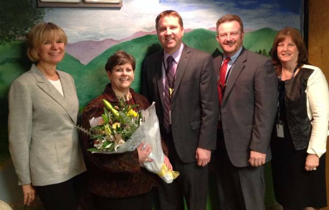 Weiss-Magasic named district's teacher of the year Coleen Weiss-Magasic, second from left, is celebrated as the district's teacher of the year. She is congratulated by district administrators, from left, Board Administrator Iris Weschling, high school Principal Paul Gorski, Superintendent of Schools James McLaughlin and Brenda Ludwig, chairperson of the Selection Committee and supervisor of world languages for the district.