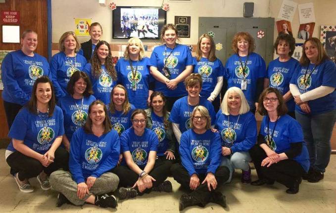 District 'lights it up blue' for autism awareness Paradise Knoll staff members were dressed in their autism awareness shirts on Monday.