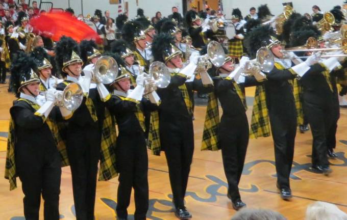 Highlanders' Tattoo is a real crowd pleaser In their signature plaid, the West Milford Highlander horn section took to the gym floor along with their bandmates.