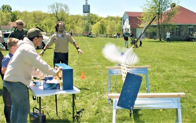 Boy Scouts launch model rockets at the Wallisch Farm.