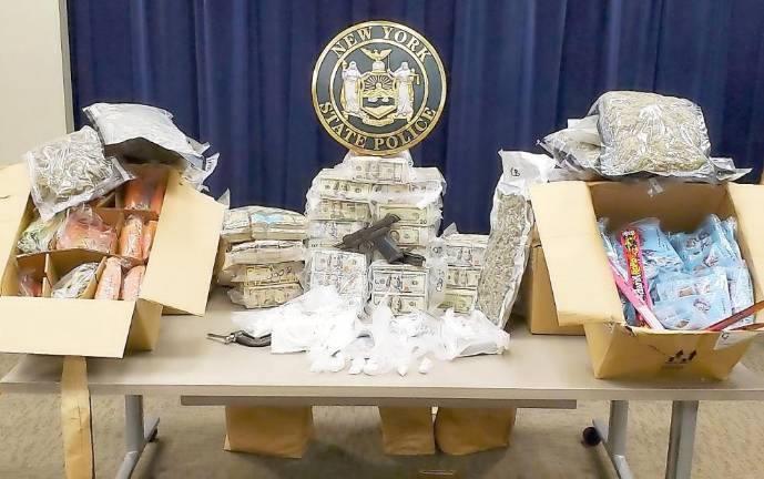 Couple charged in a major narcotics investigation District Attorney David M. Hoovler said a search warrant executed at the Montgomery home of Marius and Nancy Schwerberg yielded cocaine and marijuana having a street value of $180,000 and more than $ 1.1 million dollars in cash. Photo provided by New York State Police.