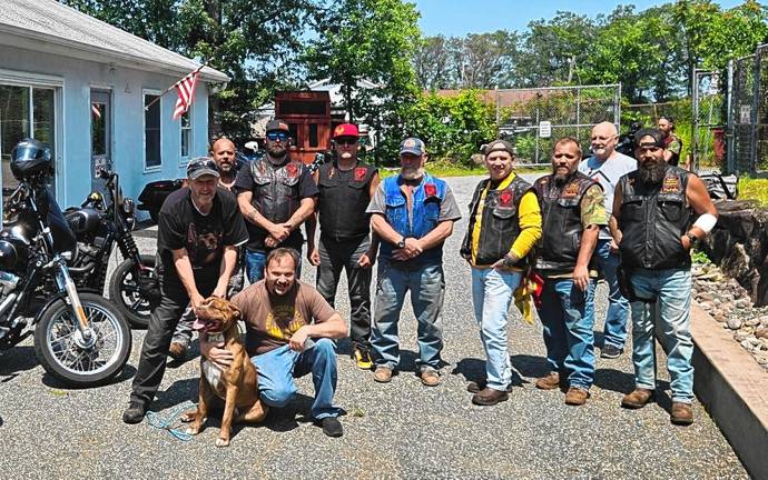 West Milford. $2,000 donation MC1 Members of the Warlocks Motorcycle Club of Sussex County donate $2,000 to the West Milford Animal Shelter Society (WMASS) on Aug. 3. The funds were raised during a recent charity event. It’s the club’s second significant donation in as many years. WMASS president Doug Weed, front, accepts the donation with Sven, a pup available for adoption. (Photo provided)