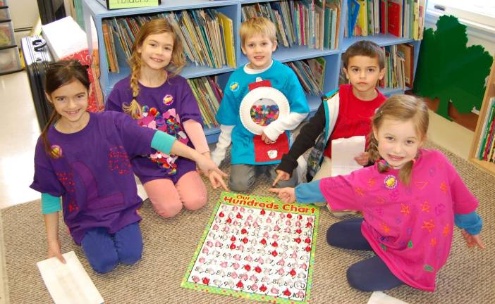 Celebrating the 100th day of school at Ringwood Christian First graders wearing their special t-shirts and completing their 100 chart.