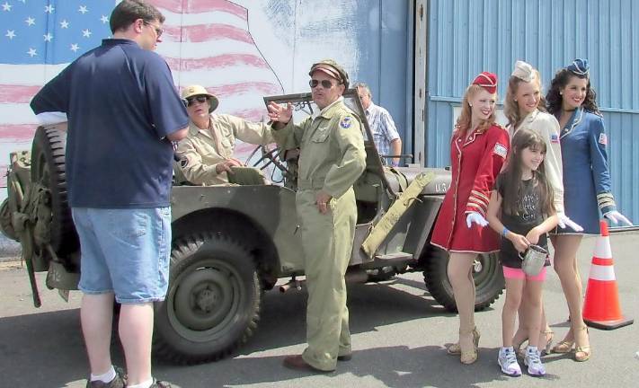 The Army Air Force Historical Association presents interactive living experiences. Enactors here portray the singing Andrew Sisters.