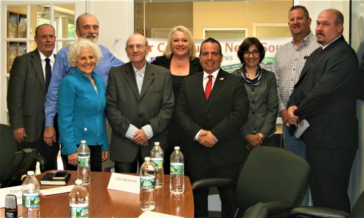 Local candidates speak Left to right; Messenger Editor Charles Kim, Warren Gross, Publisher Jeanne Straus, Robert Nicholson, Mayor Michele Dale, Township Councilman, and mayoral candidate Lou Signorino, Managing Editor Pam Chergotis, Councilman Peter McGuinness, and Kevin Goodsir. Missing, Steven Castronova.