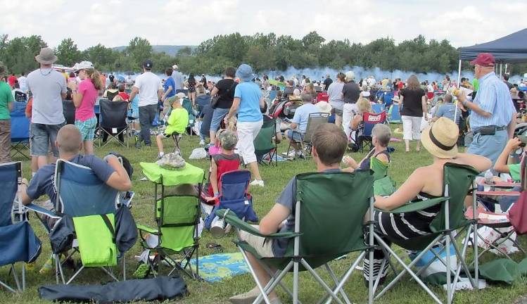 Crowds gather annually along the runway to see the air show.