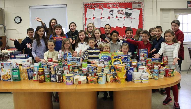 Students, teachers show the 'heart' of Ringwood Christian School Students at Ringwood Christian School show the food they collected for the Ringwood Food Bank.