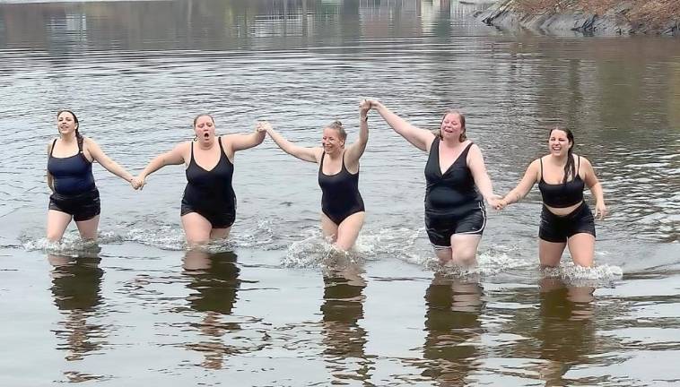 Coaches Erin Branagan, Jaime Giordano, Nicole Lungaro, Melissa Teresco and Head Coach Kristi Clave plunged into the lake where the water temperature was less than 40 degrees.